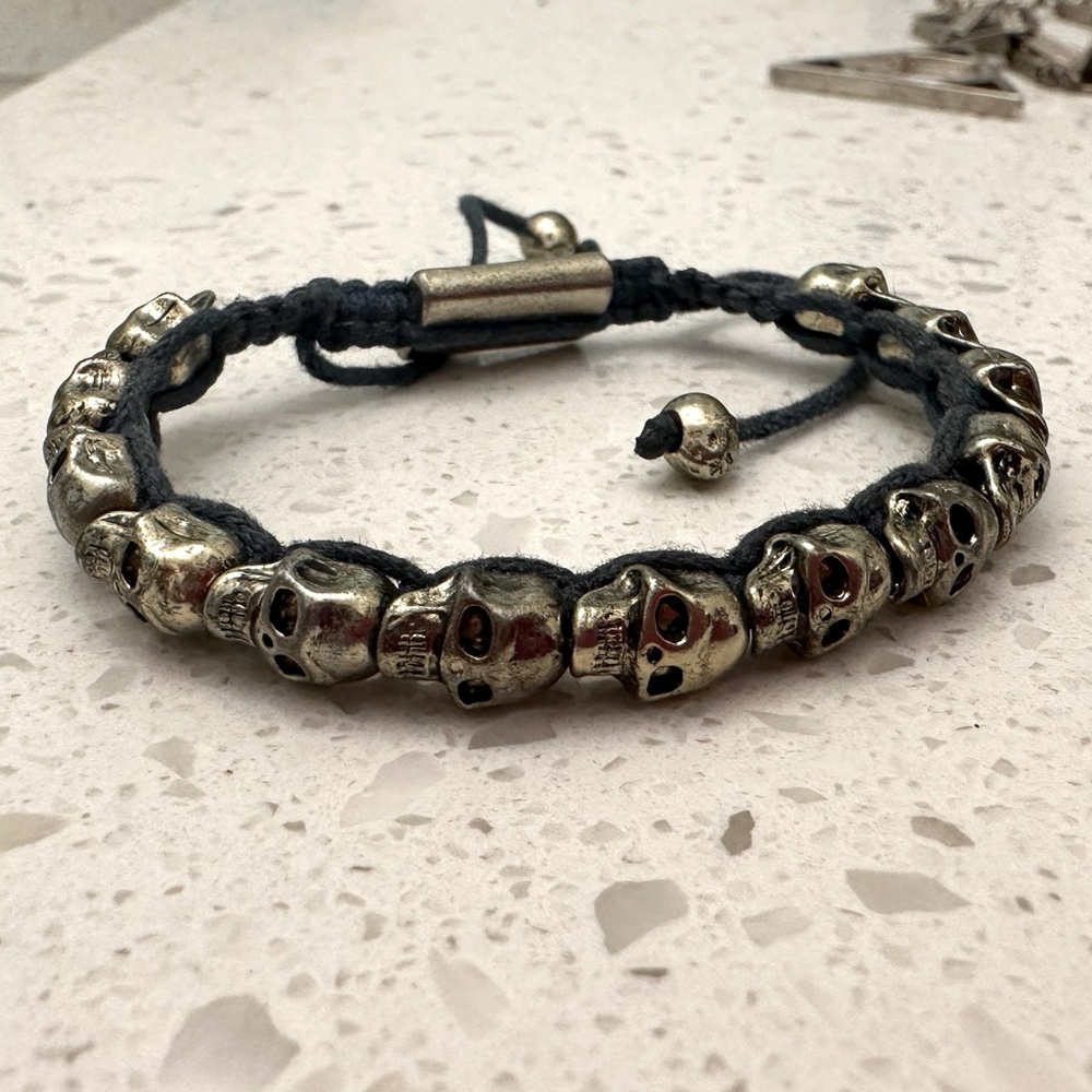 BRASS SKULL BRACELET on blue string